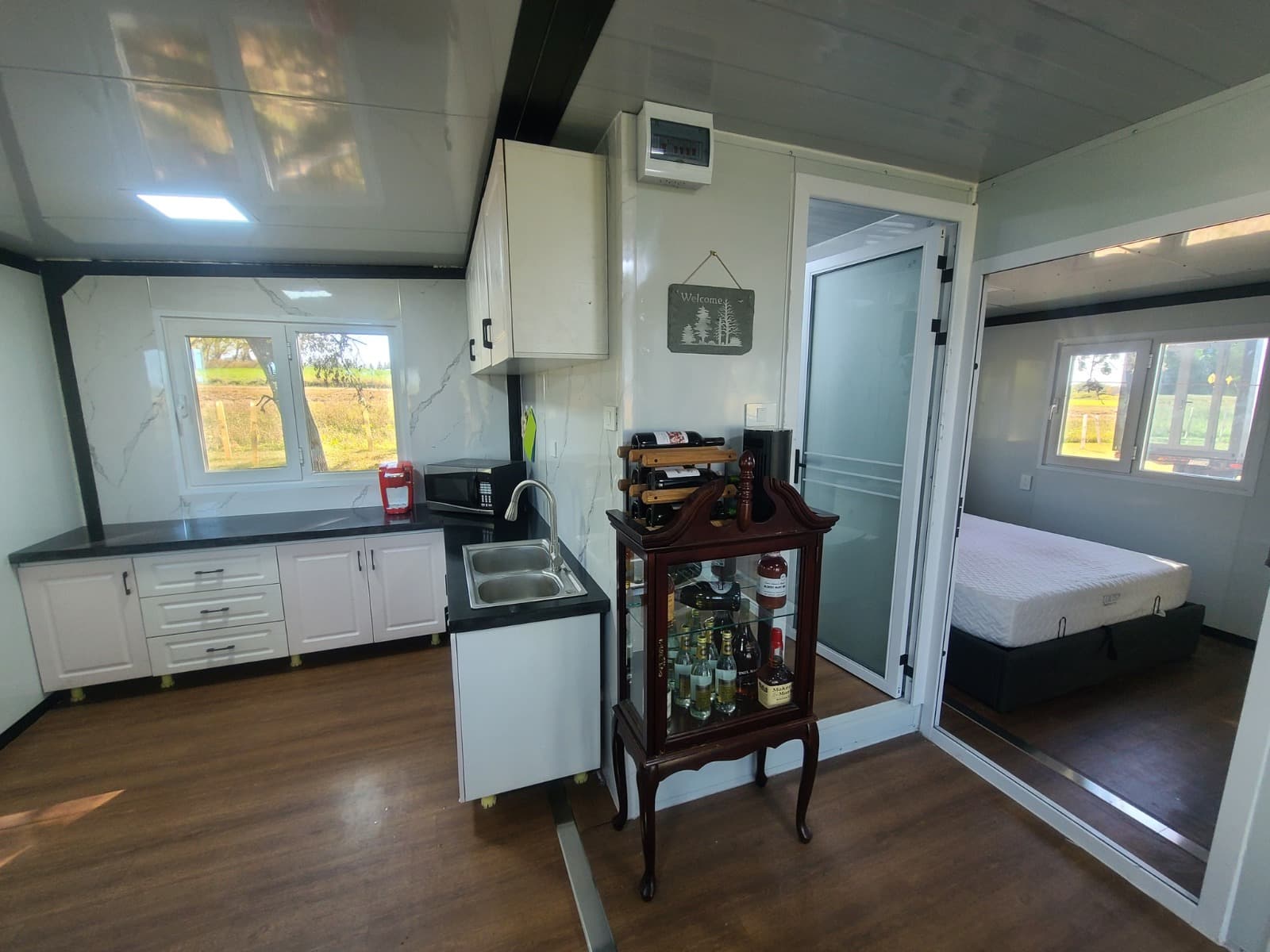 Open-plan kitchen and bedroom interior of an expandable home.