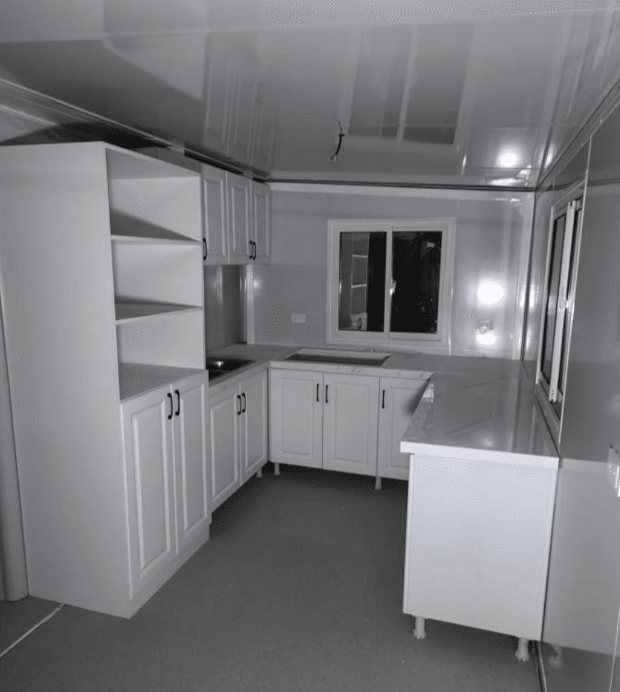U-shaped white kitchen with open shelving.