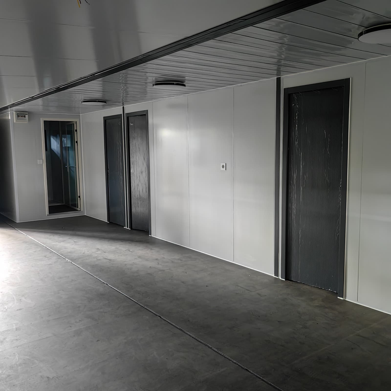 Expandable home interior hallway showing multiple room doors.