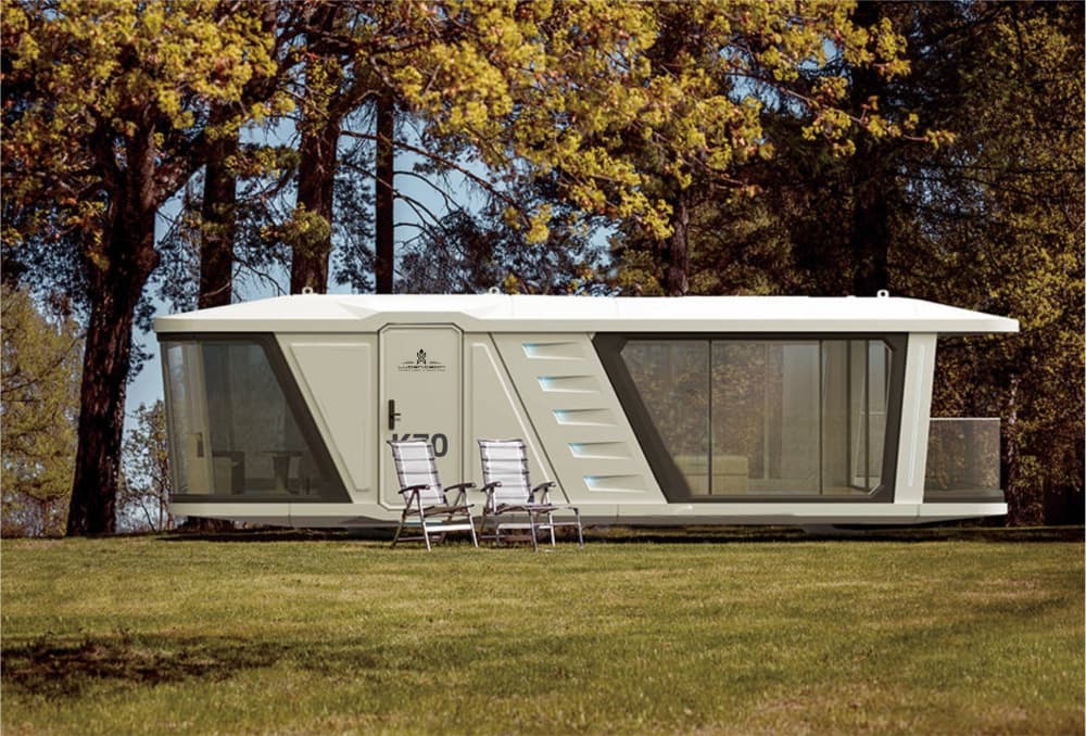 Space Capsule pod with lounge chairs on a grassy lawn.