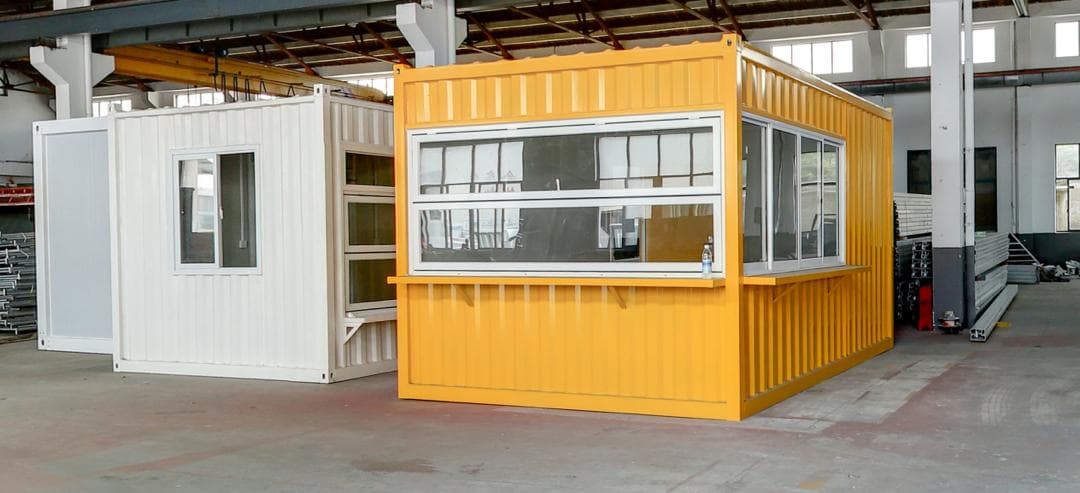 Orange container vending unit with fold-up serving windows.